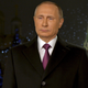 Russian President Vladimir Putin looks on as he delivers his annual New Year address to the nation in Moscow, December 31, 2015.
